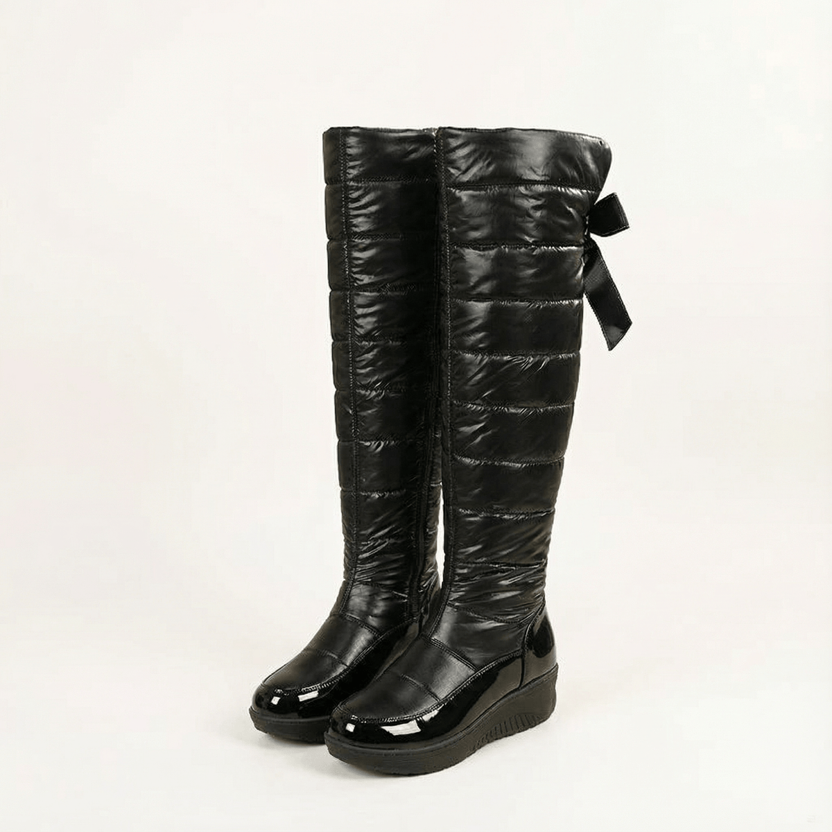 Velura Women's Black Fleece-Lined Quilted Puffer Over-the-Knee Boots with Bow Detail